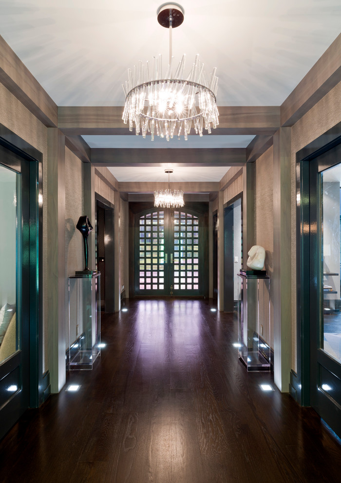 This is an example of a contemporary entrance in New York with brown walls.
