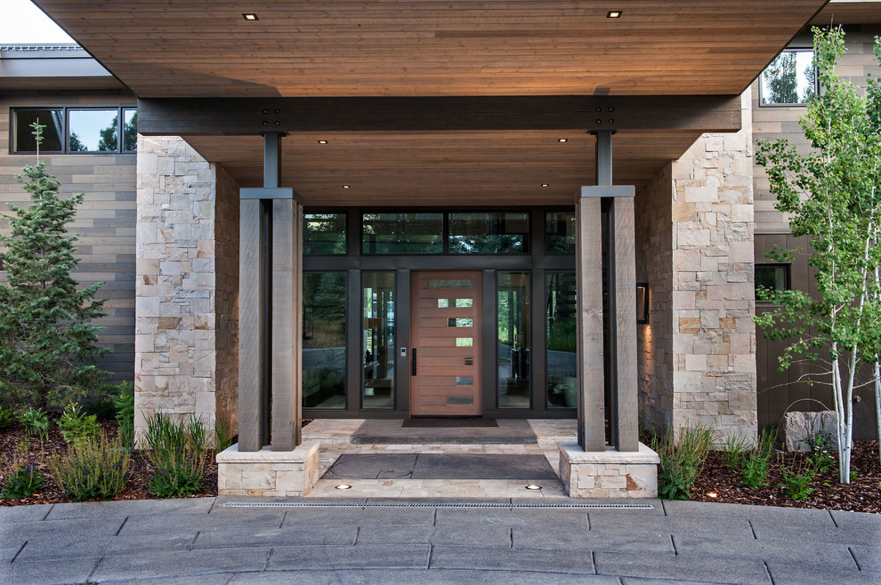 Photo of a large contemporary front door in Salt Lake City with a dark wood front door.