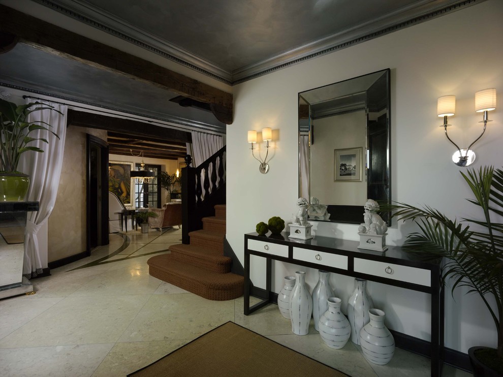 Example of a trendy foyer design in Newark with beige walls