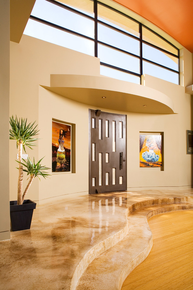 Inspiration for a contemporary entrance in Las Vegas with beige walls and a dark wood front door.