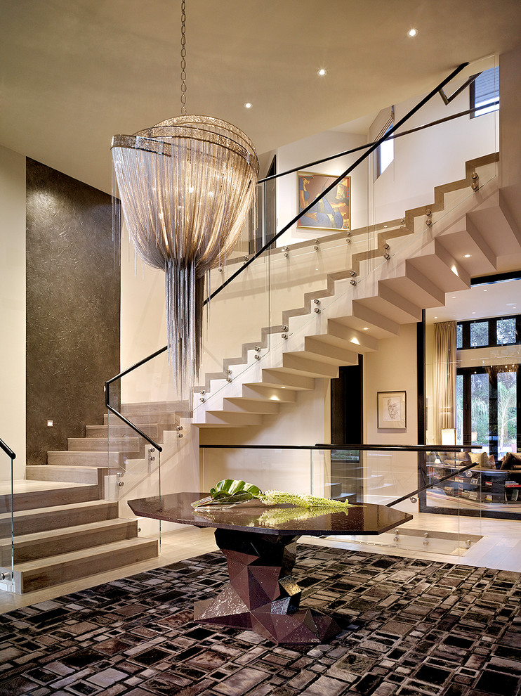 Large contemporary foyer in London with beige walls.
