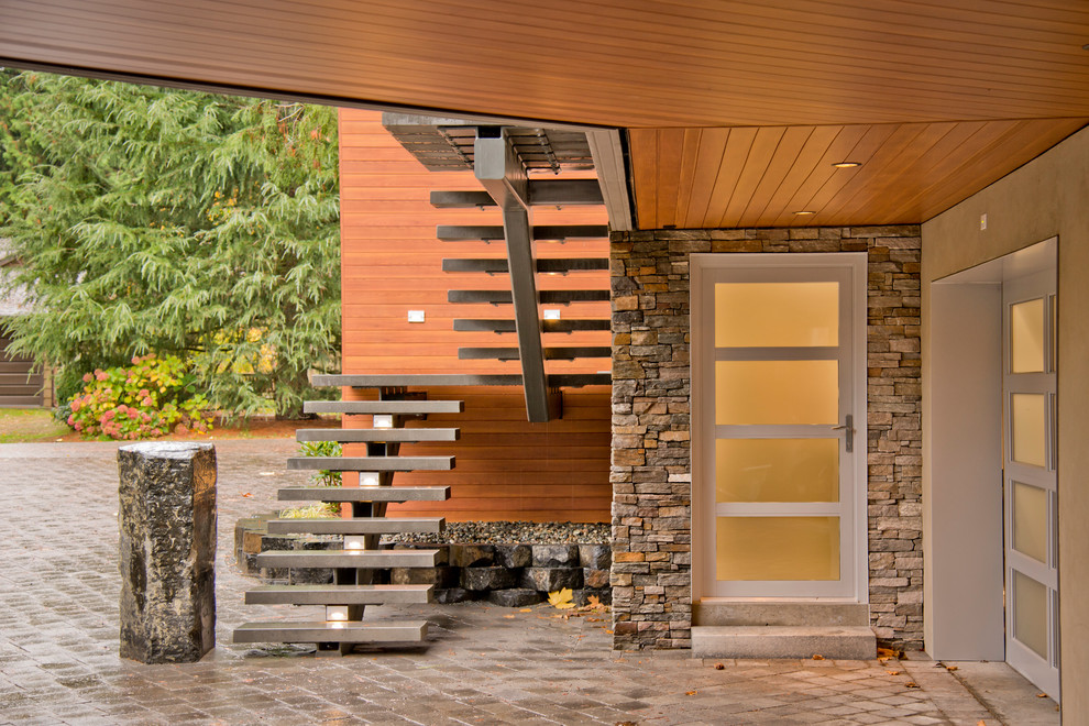 Inspiration for a contemporary entrance in Vancouver with a glass front door.