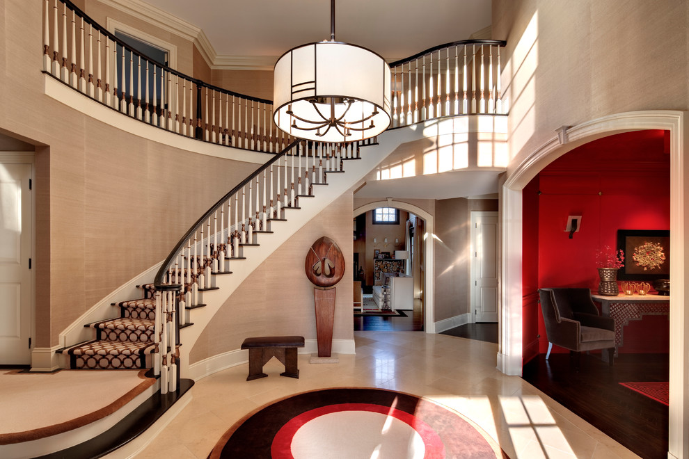 Example of a trendy foyer design in New York with beige walls