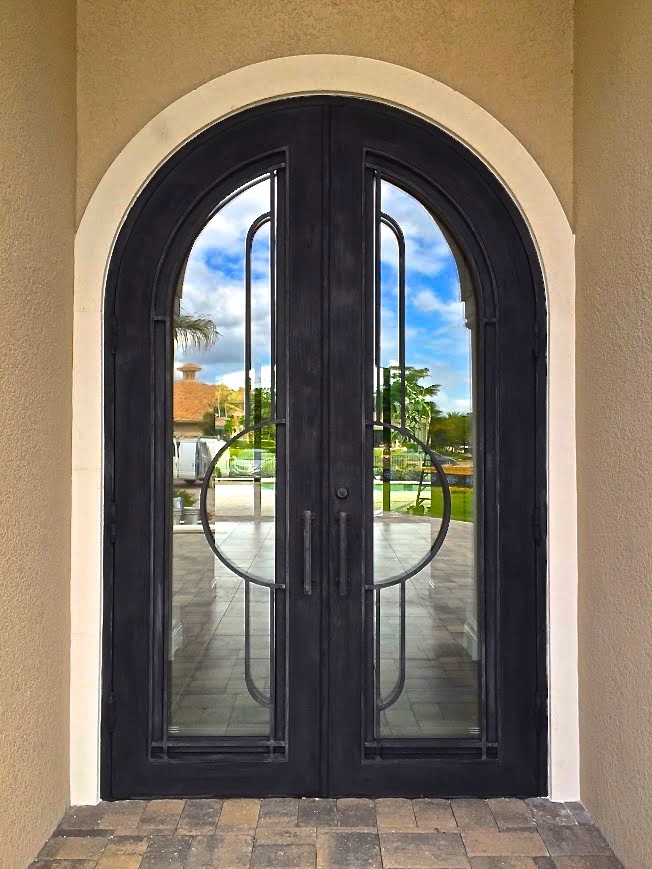 Large contemporary front door in Miami with a double front door and a metal front door.