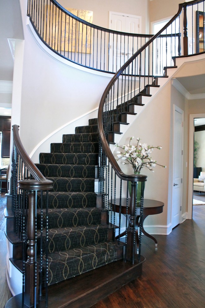 Example of a large classic dark wood floor entryway design in Dallas with beige walls and a dark wood front door