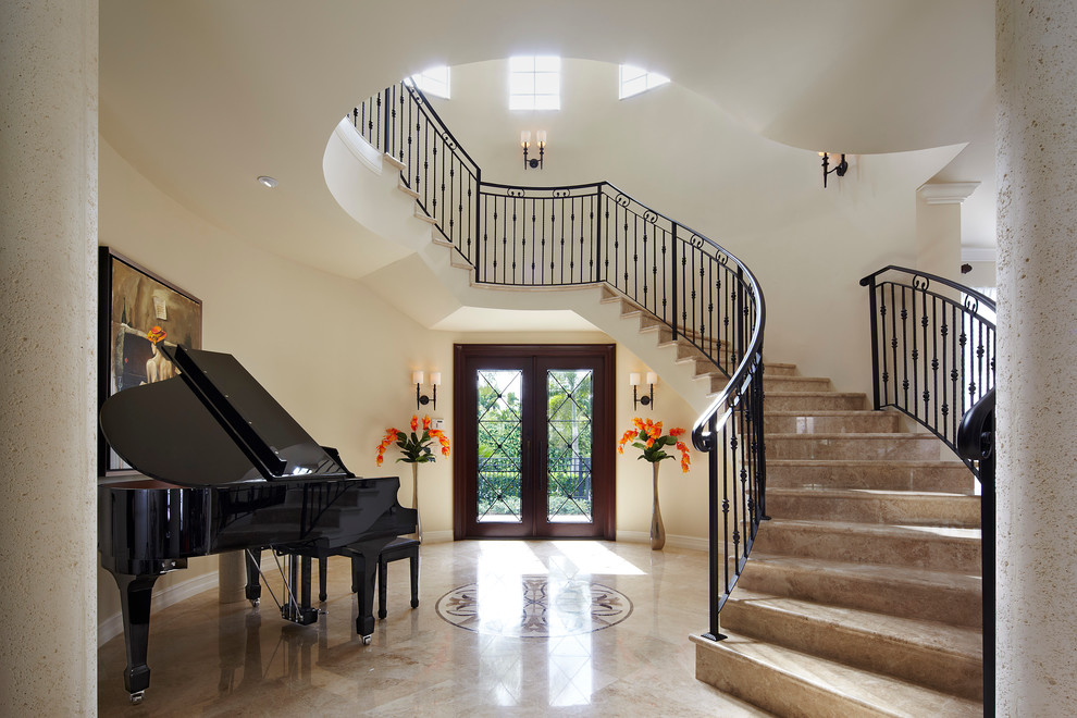 Large mediterranean foyer in Miami with white walls, marble flooring, a double front door and a dark wood front door.