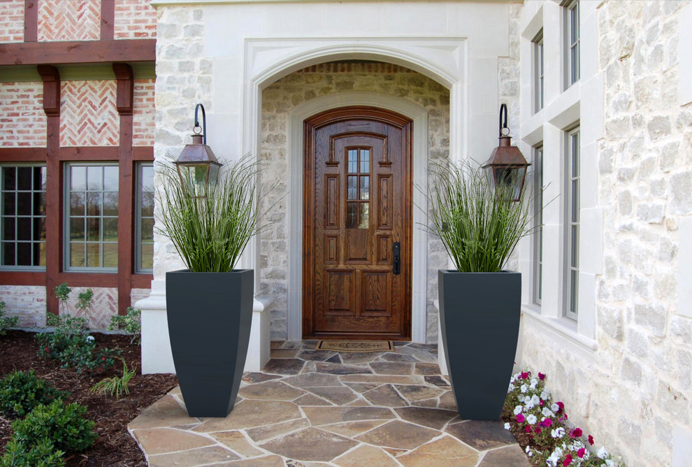 Inspiration for a large contemporary entryway remodel in Toronto with a dark wood front door