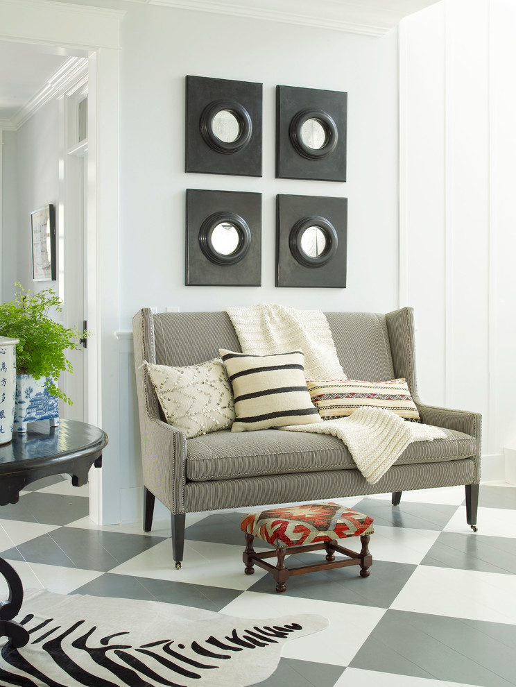 Beach style painted wood floor entryway photo in San Diego with gray walls