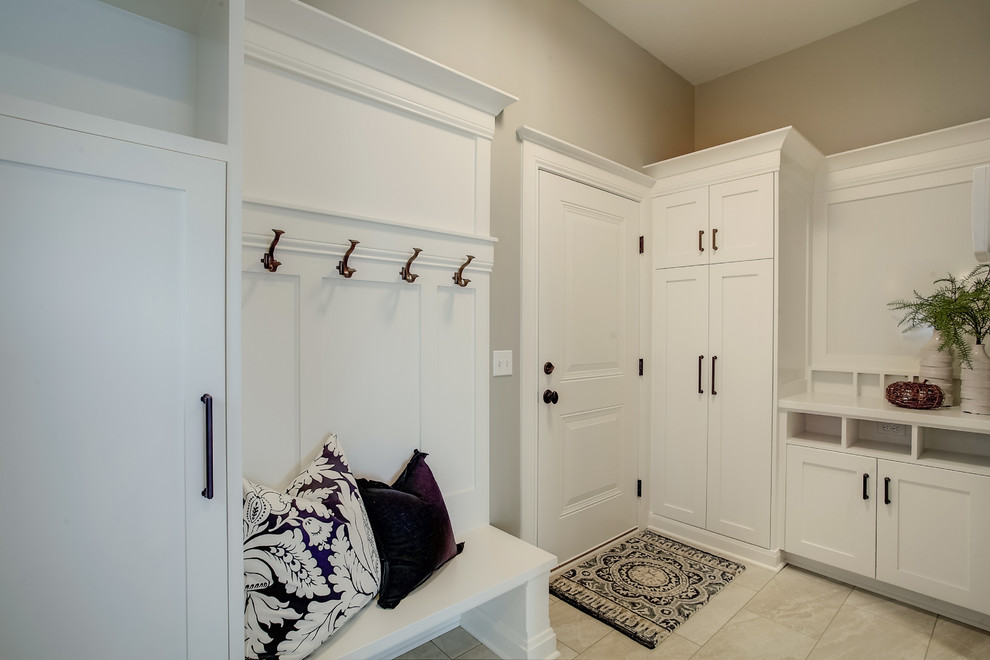 Inspiration for a small traditional boot room in Grand Rapids with beige walls, ceramic flooring, a single front door, a white front door and beige floors.