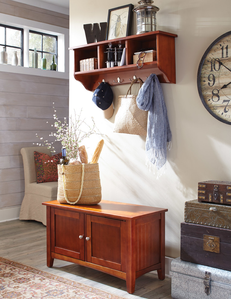 Cottage Style Mudroom Featuring Cherry Finish Storage Bench and Coat