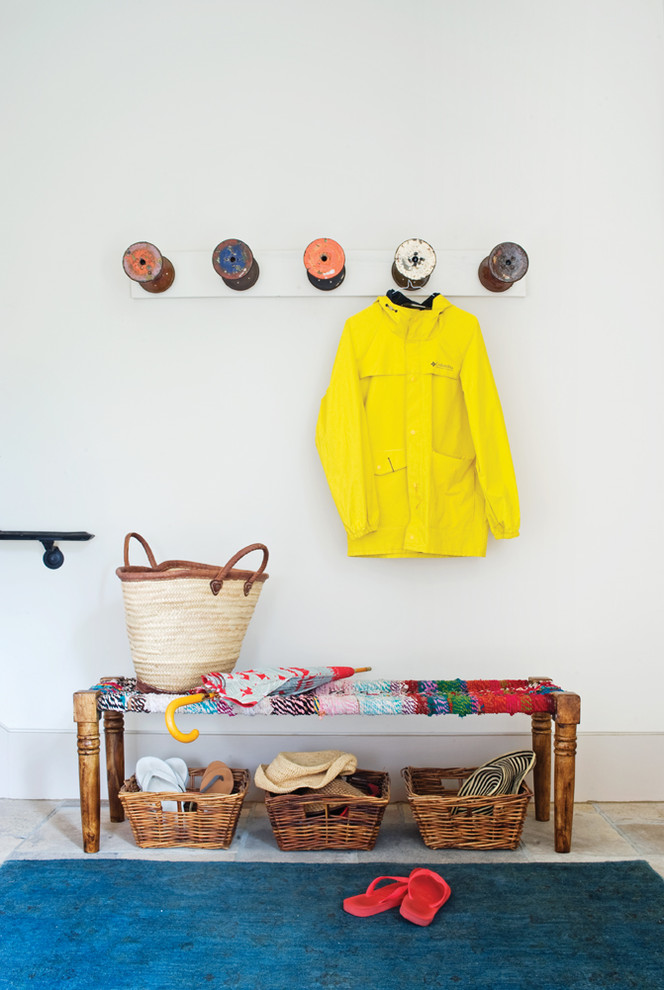Inspiration for an eclectic boot room in Toronto with white walls.