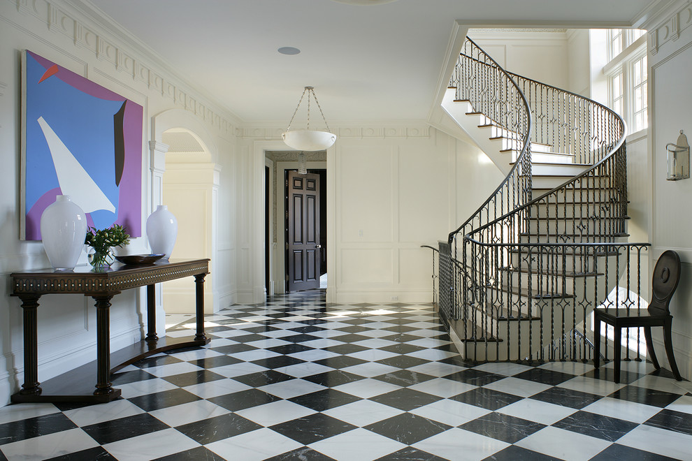 This is an example of a traditional foyer in New York with white walls.