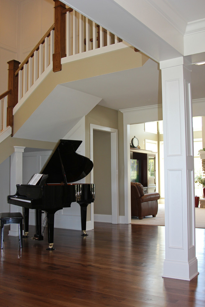 Inspiration for an expansive traditional foyer in Milwaukee with beige walls and medium hardwood flooring.