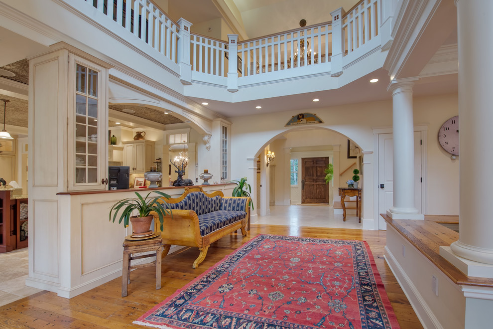 Photo of a victorian foyer in Boston with white walls and medium hardwood flooring.