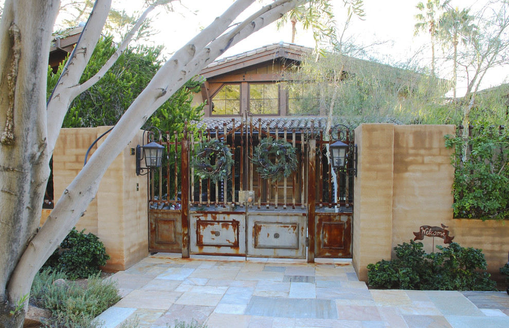 Example of a mountain style double front door design in Phoenix with a metal front door