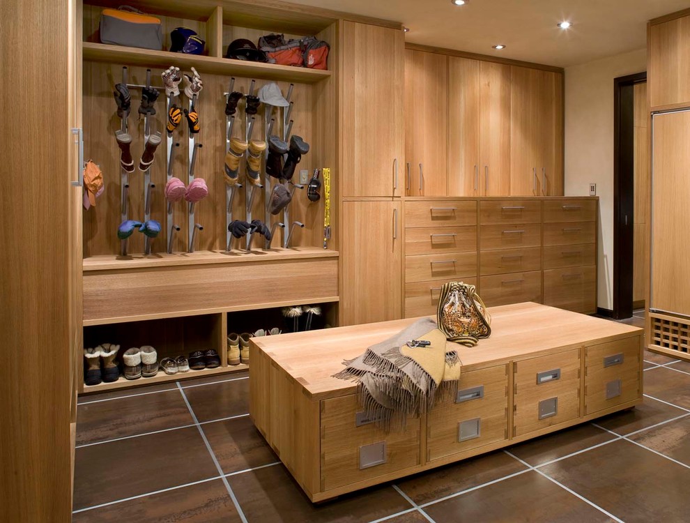 Inspiration for a large contemporary boot room in Denver with brown floors.