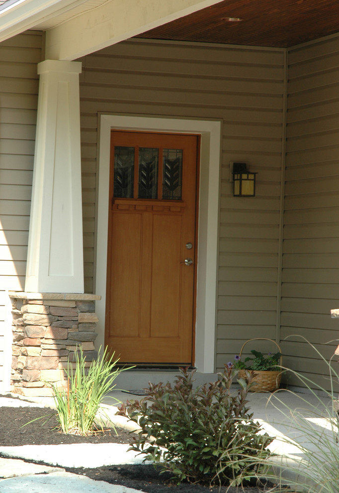 Mid-sized arts and crafts entryway photo in Cincinnati with a light wood front door