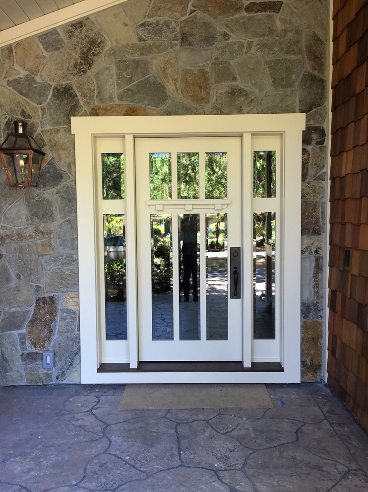 This is an example of a medium sized classic front door in San Francisco with grey walls, limestone flooring, a single front door and a white front door.