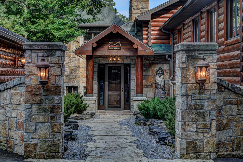 This is an example of a rustic entrance in Other with a single front door and a glass front door.