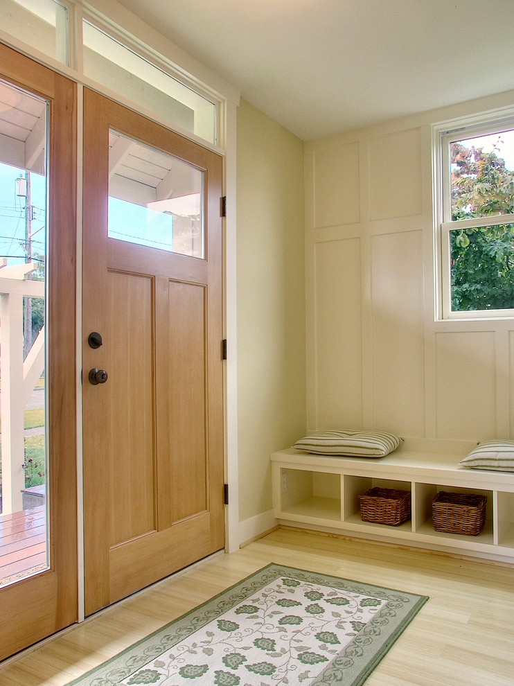 Example of a classic entryway design in Seattle with beige walls