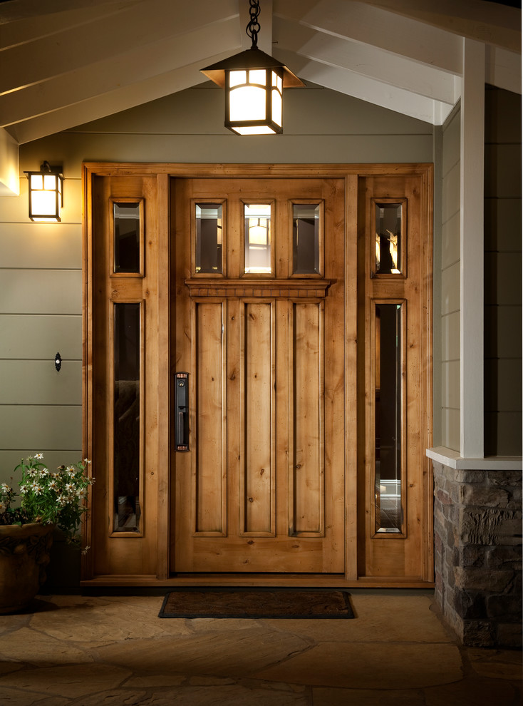 Inspiration for a timeless brown floor entryway remodel in San Francisco with a medium wood front door