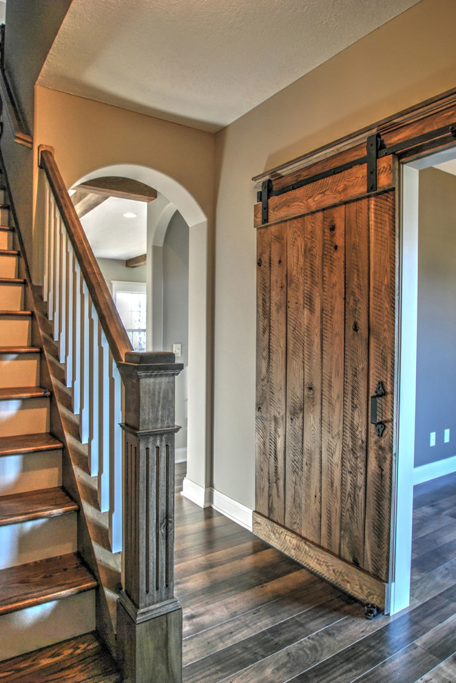 Example of a mid-sized classic dark wood floor foyer design in Cleveland