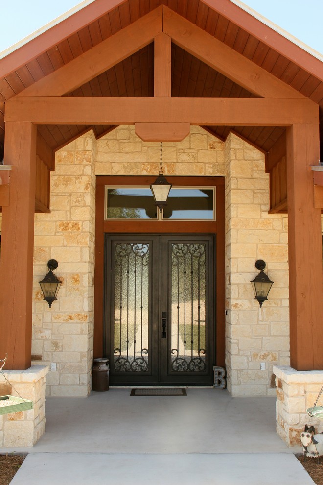 Large front door in Austin with beige walls, concrete flooring, a double front door, a glass front door and grey floors.