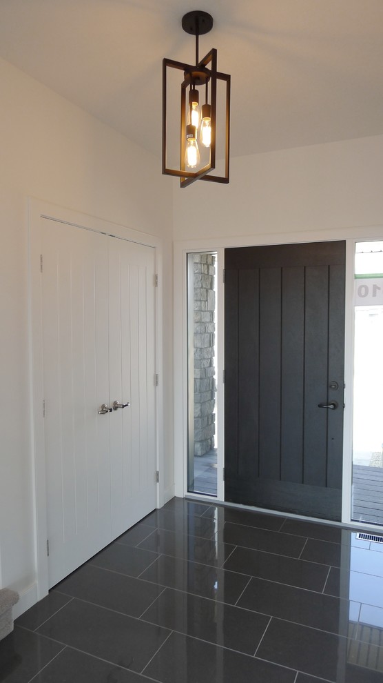 Entryway - small farmhouse entryway idea in Other