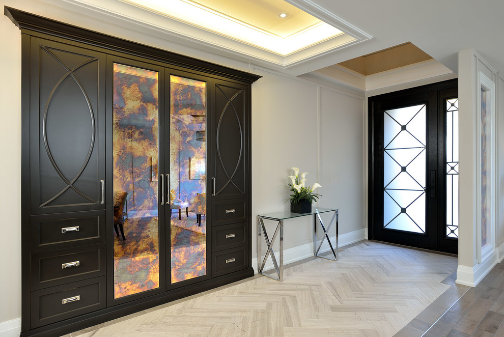 Entryway - mid-sized transitional marble floor entryway idea in Toronto with beige walls and a black front door