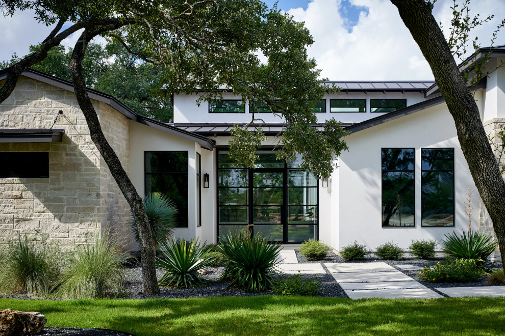 Design ideas for a classic front door in Austin with white walls, a single front door and a glass front door.