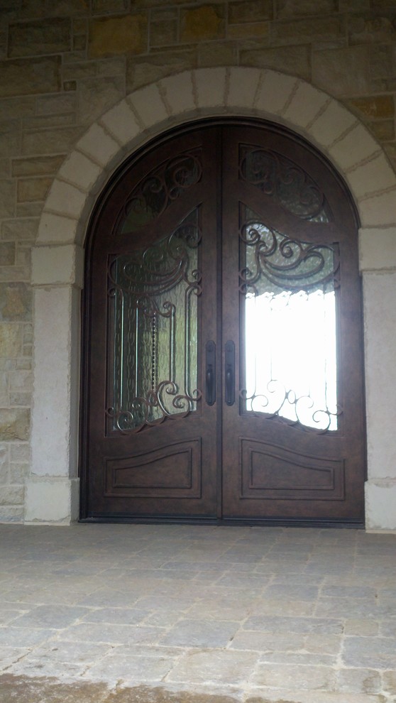 Example of a small classic entryway design in Other with a metal front door