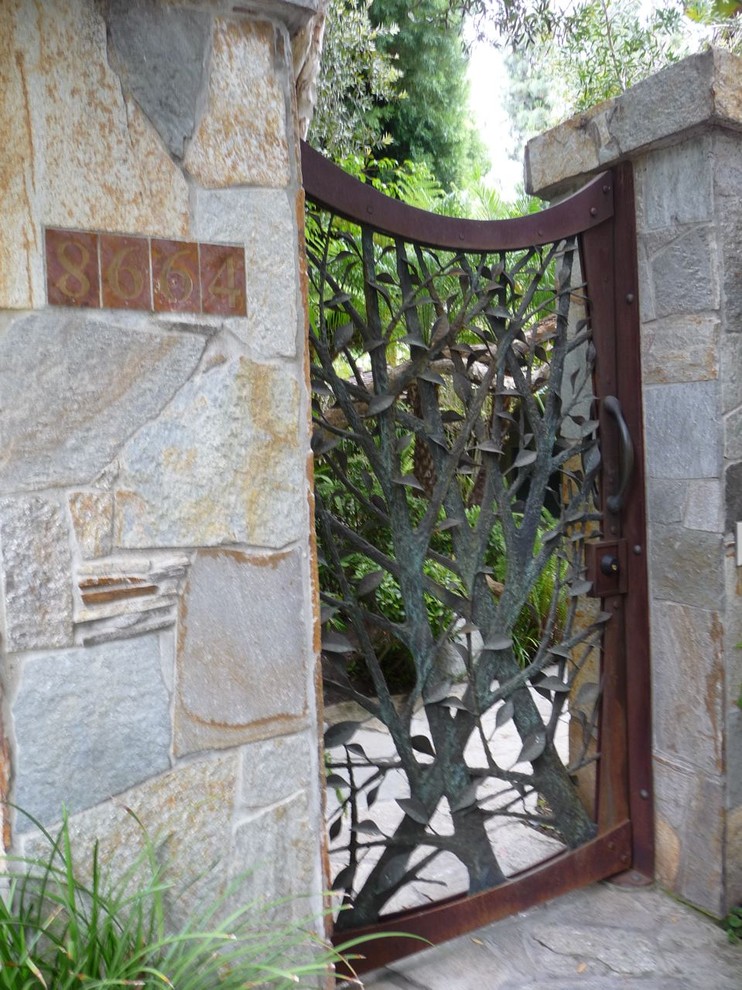 Design ideas for a contemporary entrance in Los Angeles with a metal front door.