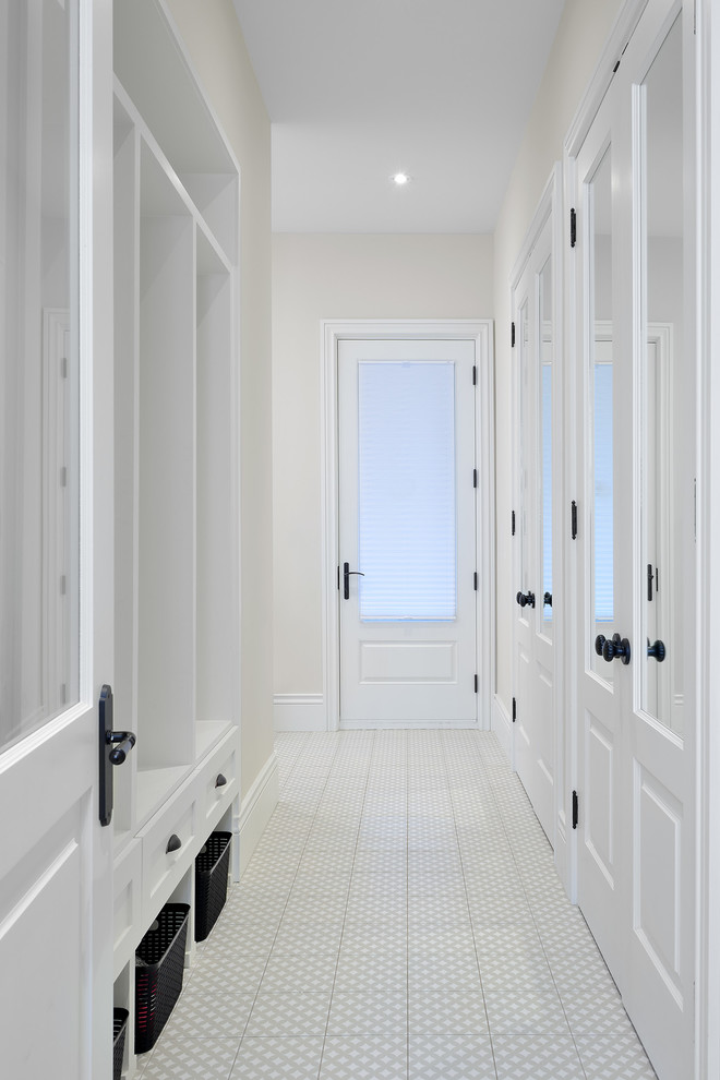 This is an example of a small contemporary boot room in Toronto with grey walls, ceramic flooring, a single front door, a white front door and white floors.