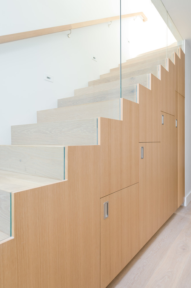 Inspiration for a small coastal wooden staircase remodel in Orange County with wooden risers