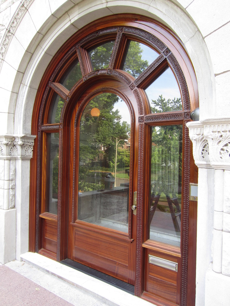 Front door - traditional front door idea in St Louis with a medium wood front door
