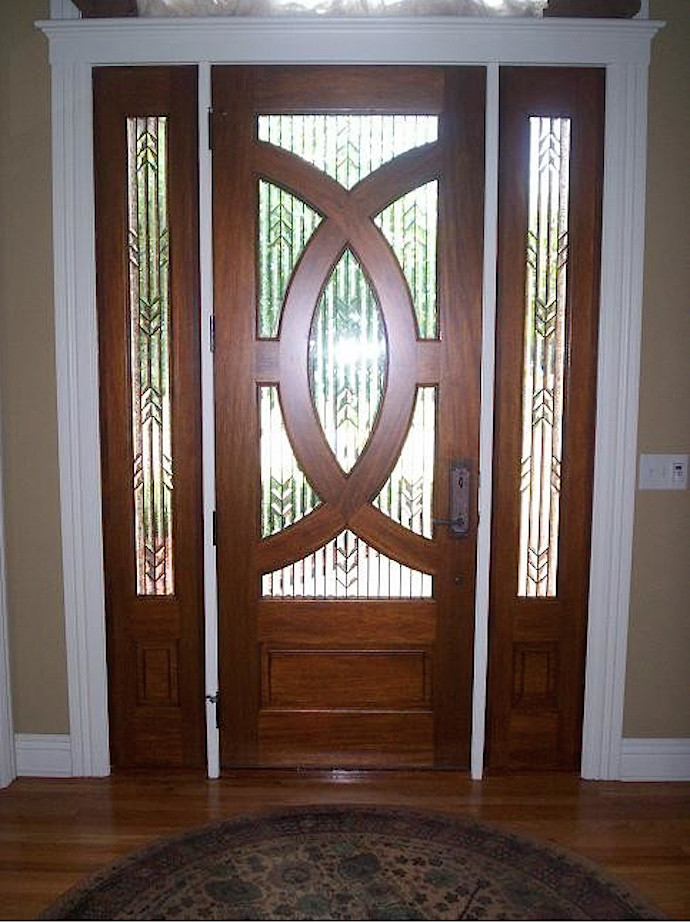 Entryway - mid-sized entryway idea in Other with a medium wood front door