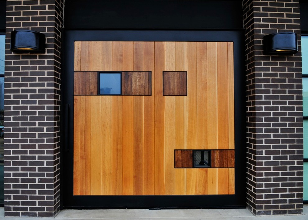 Источник вдохновения для домашнего уюта: входная дверь среднего размера в современном стиле с черными стенами, бетонным полом, двустворчатой входной дверью и входной дверью из дерева среднего тона