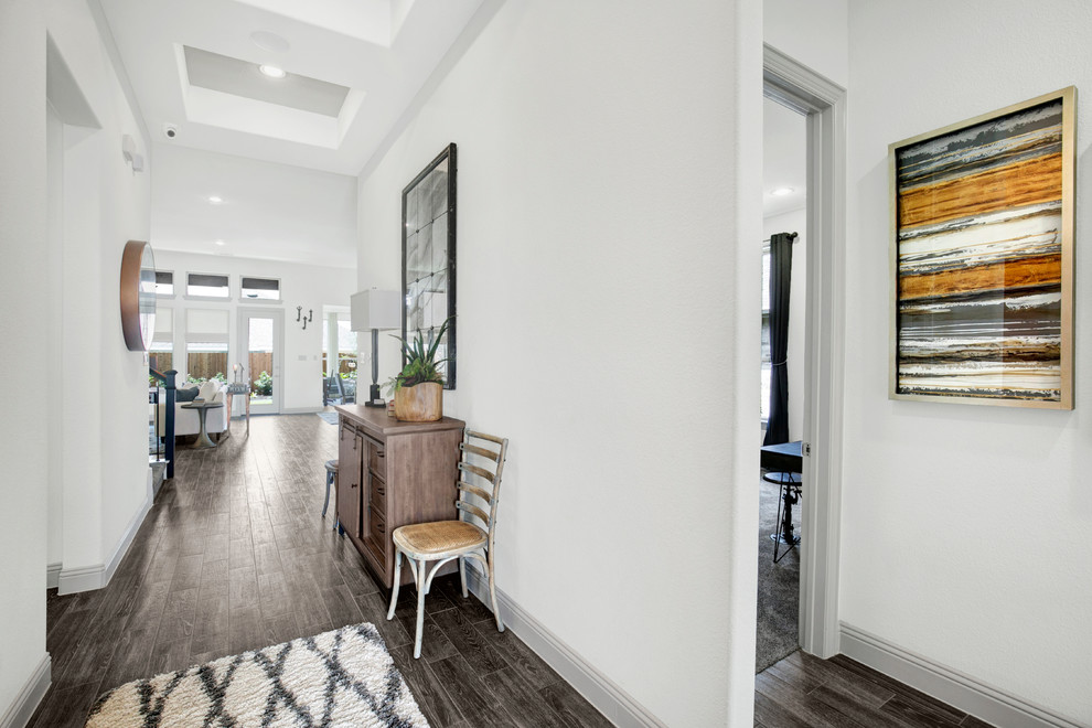 Medium sized contemporary hallway in Dallas with white walls, dark hardwood flooring, a single front door, a glass front door and brown floors.