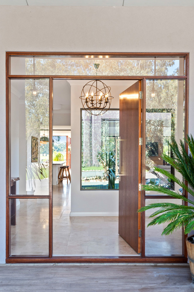 Design ideas for a large contemporary entrance in Perth with beige walls, porcelain flooring, a single front door, a dark wood front door and beige floors.