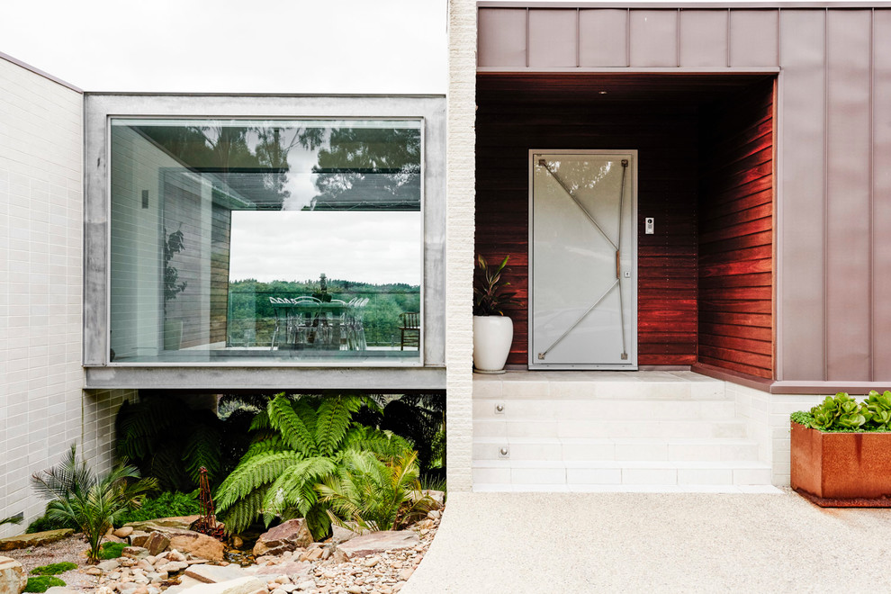 Inspiration for a contemporary single front door remodel in Geelong