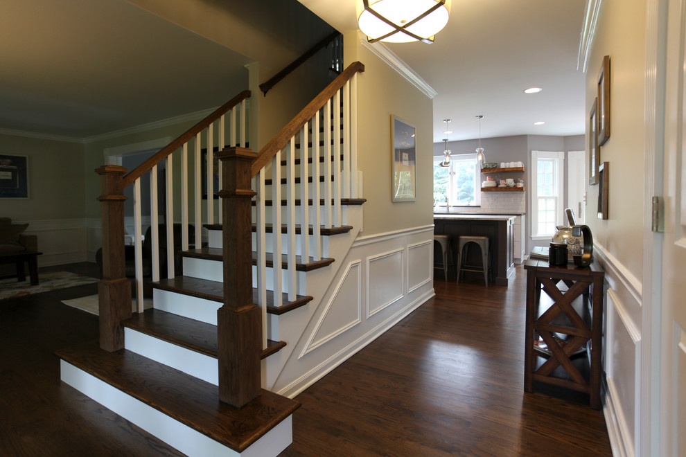 Inspiration for a mid-sized farmhouse dark wood floor foyer remodel in Chicago with beige walls