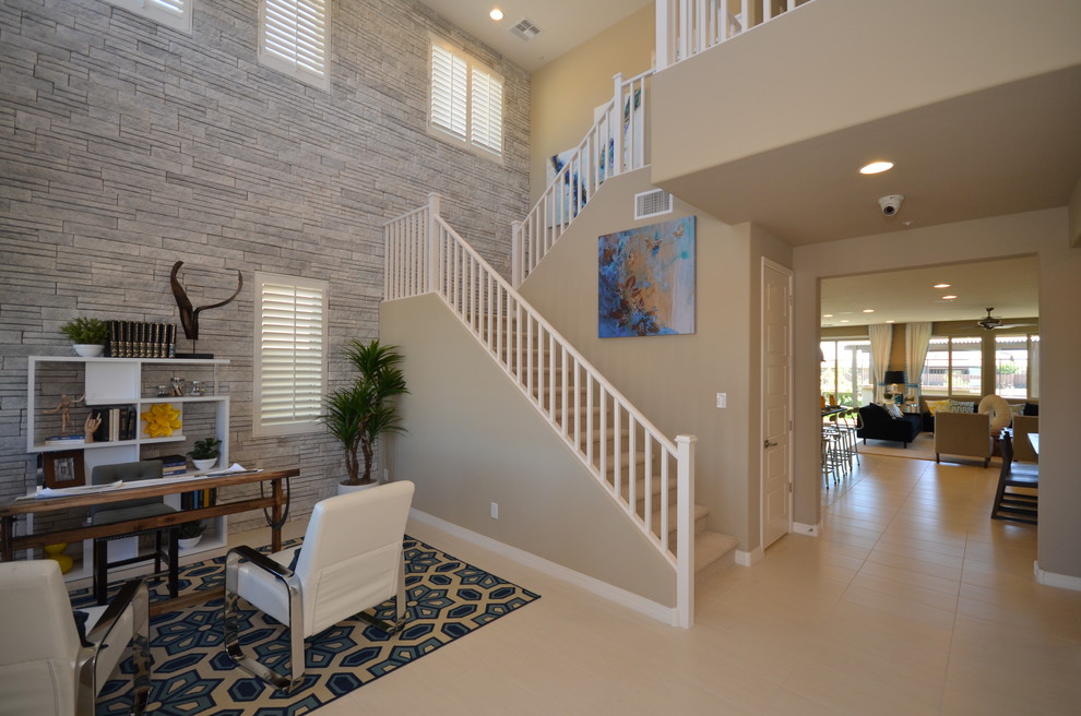 Example of a mid-sized minimalist porcelain tile entryway design in Phoenix with beige walls and a white front door