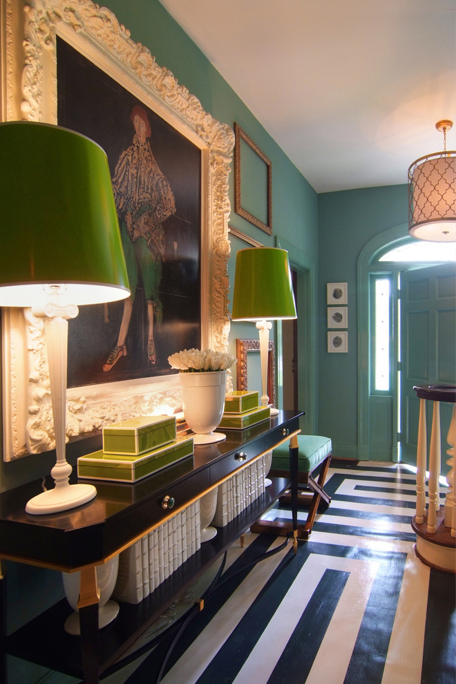 Inspiration for a mid-sized eclectic painted wood floor entryway remodel in New Orleans with green walls