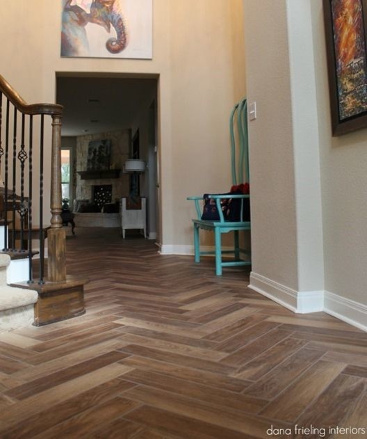 Example of a large southwest medium tone wood floor foyer design in Toronto with gray walls