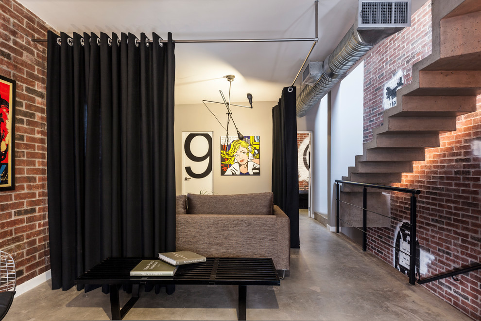 Example of a trendy concrete floor entryway design in Other