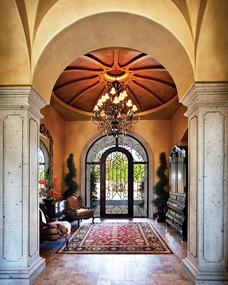 Design ideas for a large mediterranean vestibule in Phoenix with a single front door and a glass front door.
