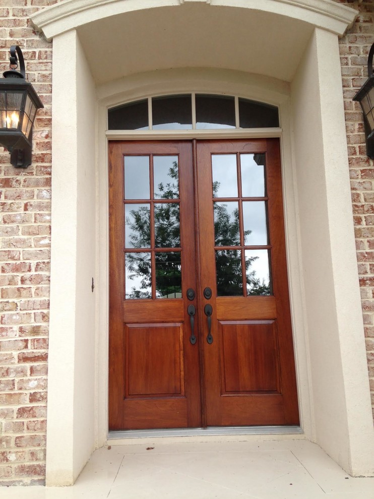 Photo of a medium sized classic front door in Nashville with concrete flooring, a double front door and a medium wood front door.