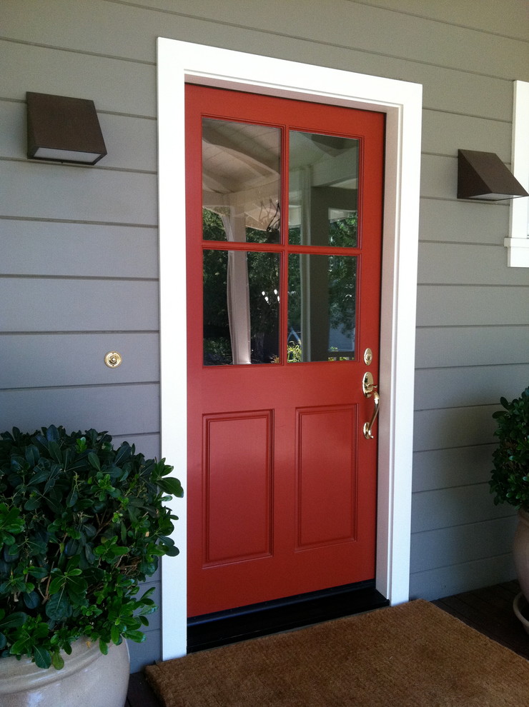 Ispirazione per una porta d'ingresso contemporanea di medie dimensioni con una porta singola e una porta rossa