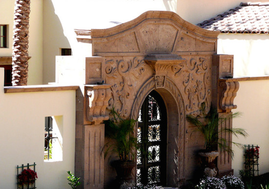 Entryway - large entryway idea in Phoenix with beige walls and a black front door