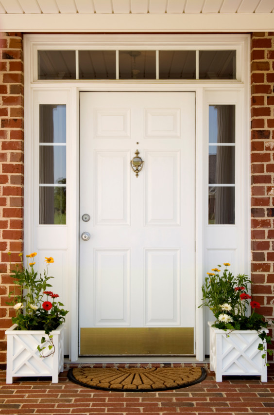 This is an example of a medium sized classic front door in Austin with red walls, brick flooring, a single front door, a white front door and red floors.
